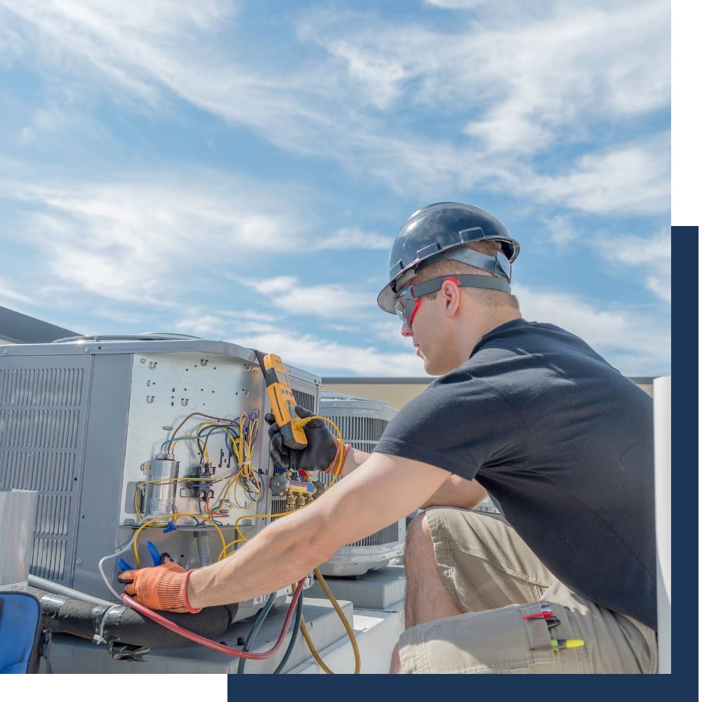 Technician reading refrigerant gauges at an outdoor unit